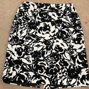 black and white pencil skirt. Has hoops for a small belt (not included).